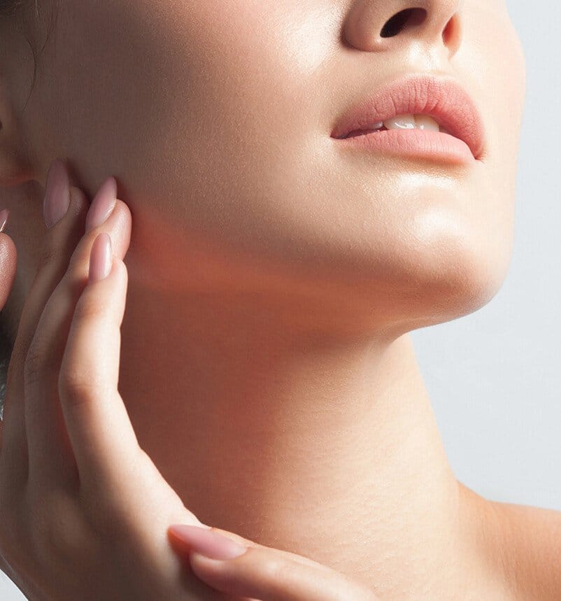 woman touching her face