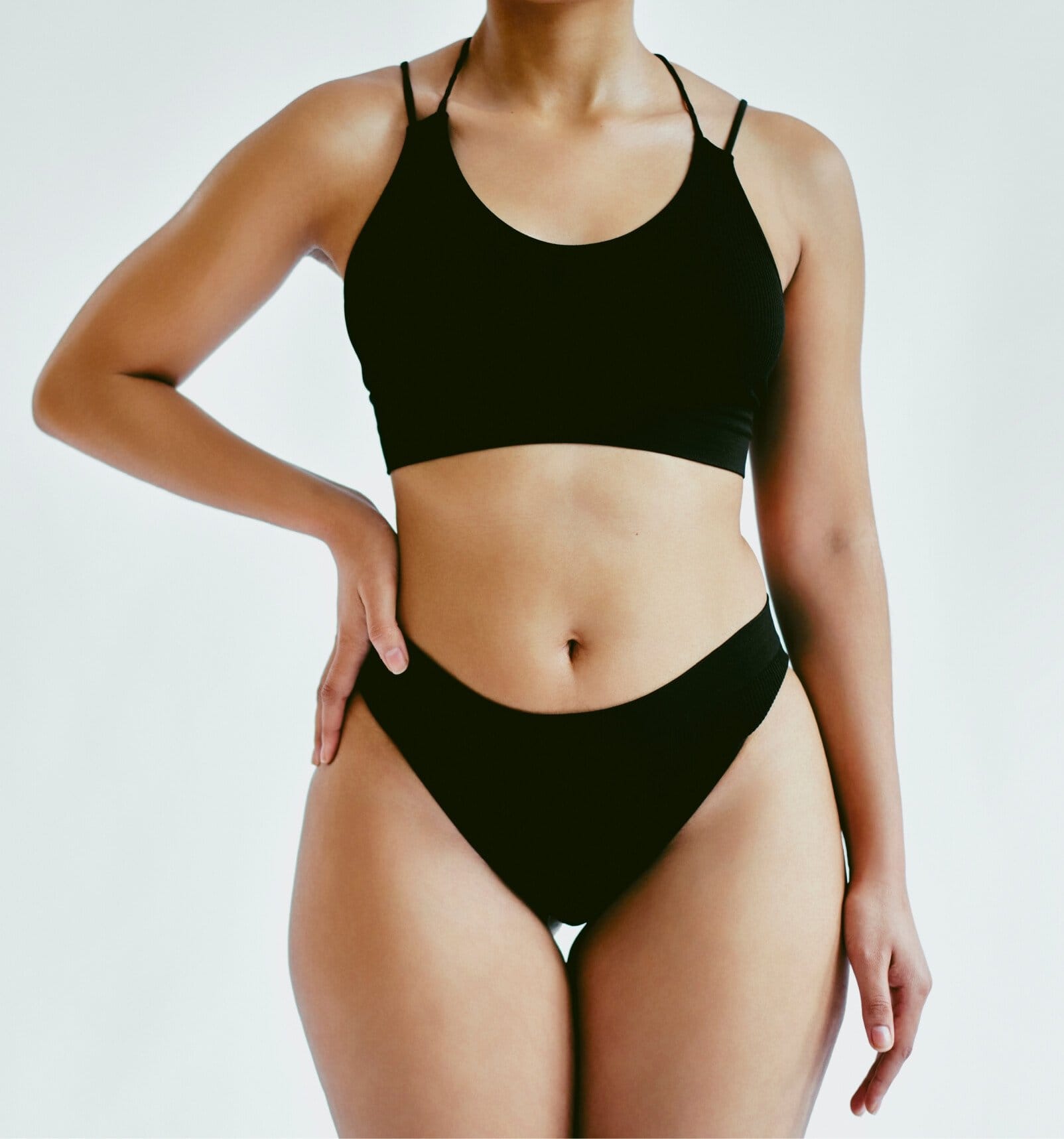there is a woman in a black bikini top and a black panties