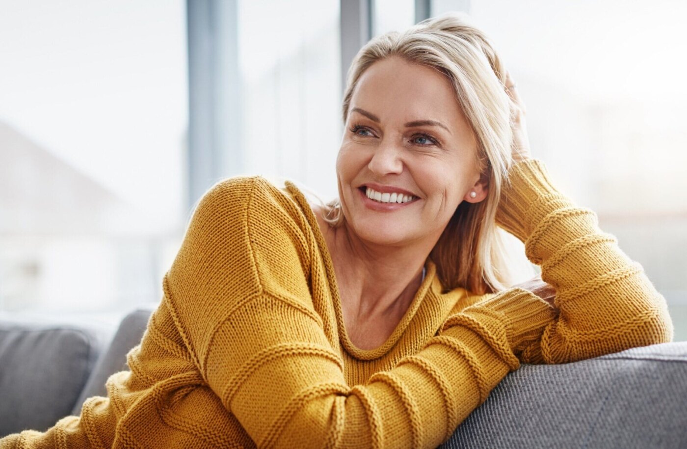 woman in a yellow sweater