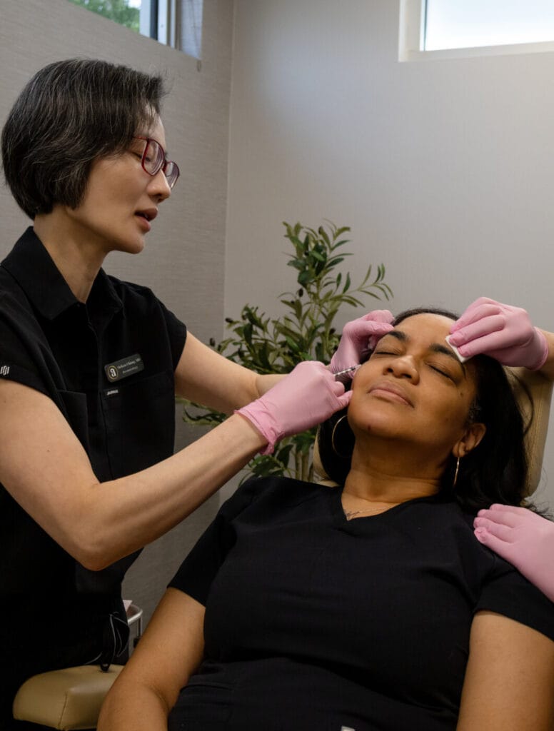 Doctor Performing Injectables on Female Patient
